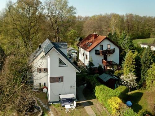 an aerial view of a white house with a yard at Luxurious Apartment in Sch now with Sauna in Bernau bei Berlin