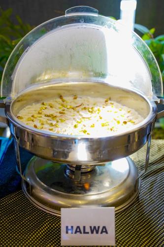 a pot of food sitting on top of a table at Trivelles Executive Suites Islamabad in Islamabad