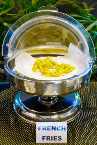 a food processor with some food on top of it at Trivelles Executive Suites Islamabad in Islamabad