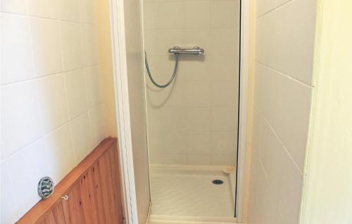 a shower with a glass door in a bathroom at 1 Bedroom Beautiful Home In Melrand in Melrand