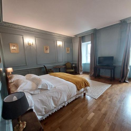 Katil atau katil-katil dalam bilik di Les Chambres du Château du Rozel