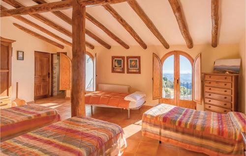 Ένα ή περισσότερα κρεβάτια σε δωμάτιο στο Amazing Home In Gaucn With 3 Bedrooms, Wifi And Outdoor Swimming Pool