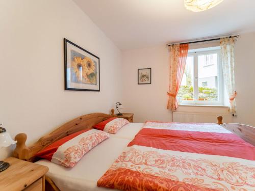 a bedroom with two beds and a window at Reifferscheid Wellness Escape in Hellenthal