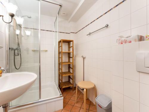 a bathroom with a sink and a shower at Reifferscheid Wellness Escape in Hellenthal