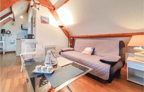 a living room with a couch and a glass table at Cozy Apartment In Alette With Wifi in Alette
