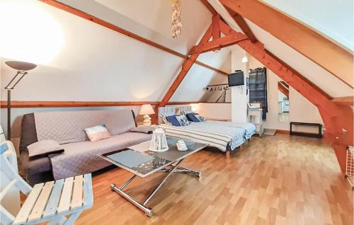 a living room with a couch and a table at Cozy Apartment In Alette With Wifi in Alette