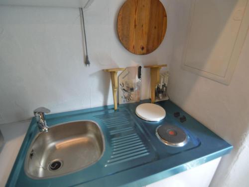 a small bathroom with a sink and a toilet at Romantic Eifel Hideaway in Immerath