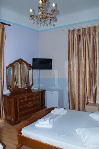 Postel nebo postele na pokoji v ubytování Diethnes Hotel
