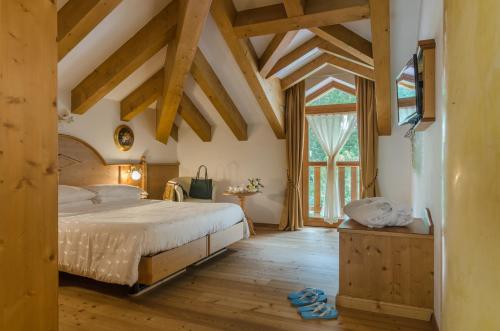 Postel nebo postele na pokoji v ubytování Hotel Rosa Degli Angeli