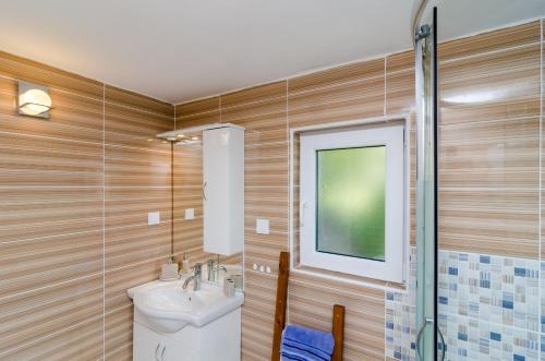 a bathroom with a toilet and a sink and a shower at Apartment Jasmin in Dubrovnik