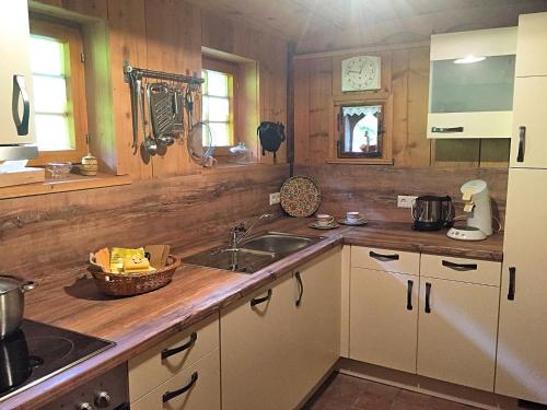 a kitchen with a sink and a counter at Holiday home in the Black Forest with sauna in Berneck