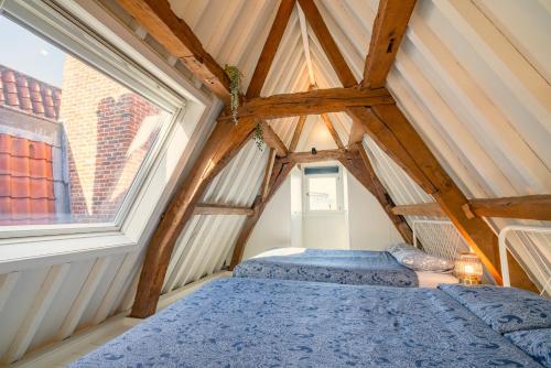 Cama o camas de una habitación en The Hendrik Square Residence