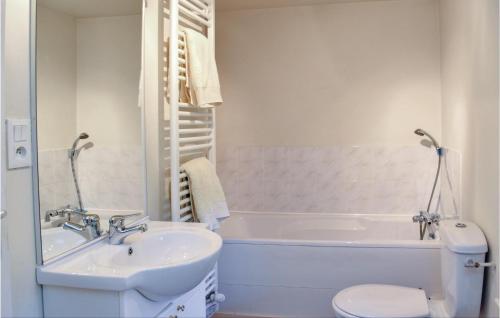 a bathroom with a sink and a tub and a toilet at 3 Bedroom Gorgeous Home In Saint Manvieu Bocage in Saint-Manvieu-Bocage