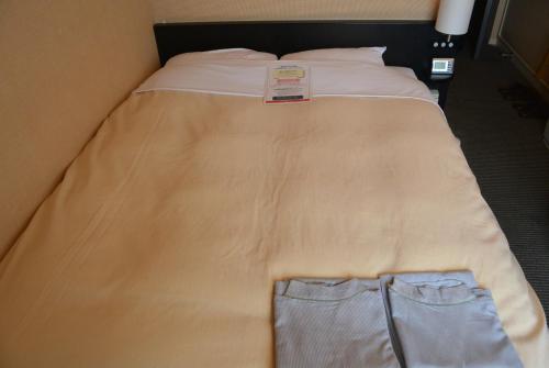 Ένα ή περισσότερα κρεβάτια σε δωμάτιο στο Hotel Crown Hills Kushiro