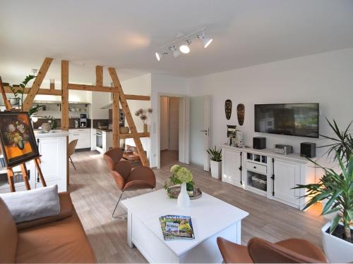 a large living room with a kitchen and a living room at Apartment with sauna in Sch nbrunn Thuringia in Schönbrunn
