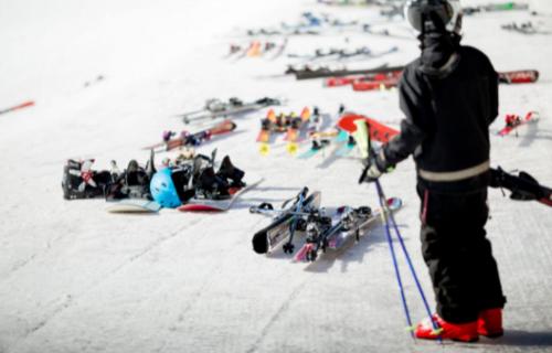 a man is standing on skis in the snow at Hotell Tjamstan Malå in Malå