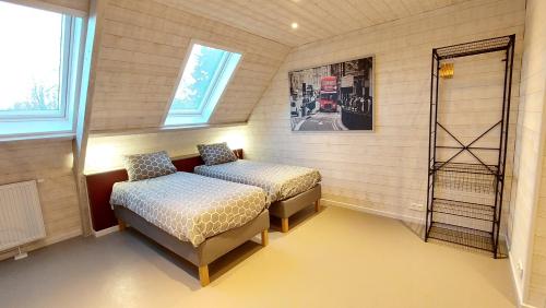 Ένα ή περισσότερα κρεβάτια σε δωμάτιο στο Au coquelicot : gîte cosy pour 8 pers. avec jardin