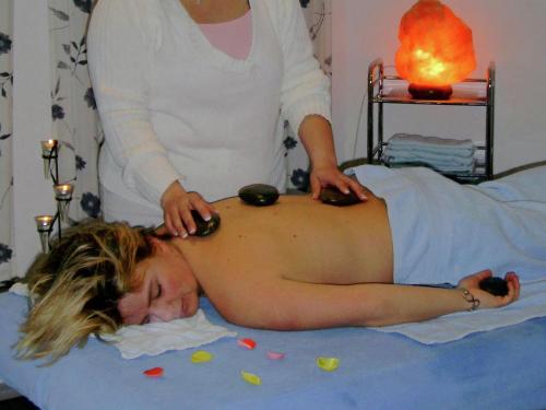 a woman getting her hair cut by a therapist at Geräumige Ferienwohnung in Stocking in Waldnähe in Waldkirchen