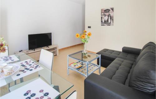 a living room with a couch and a table at Awesome Apartment In Alicante With Wifi in Alicante