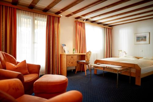 Postel nebo postele na pokoji v ubytování Casanna Hotel Davos City Center