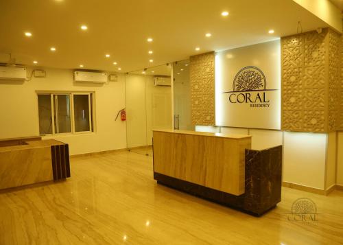 a lobby with a reception desk in a building at CORAL RESIDENCY in Rāmanāthapuram