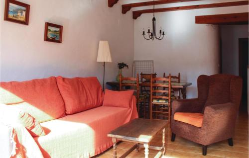 a living room with a couch and a table and chairs at Tropicanapark in Denia
