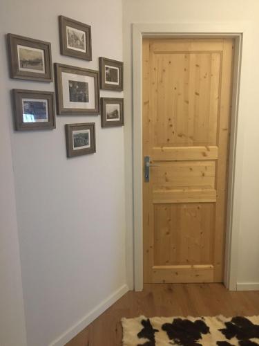 a room with a door and pictures on the wall at Haus Alpentraum in Patergassen