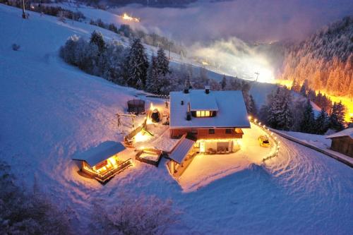 an aerial view of a house in the snow at night at Residenz Erschbaum in Valdaora