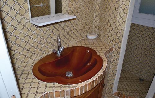 a brown sink in a bathroom with a mirror at 1 Bedroom Gorgeous Home In Cuebris in Cuébris