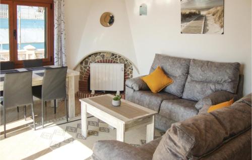 a living room with a couch and a table at Cozy Home In Ses Covetes With Wifi in Ses Covetes