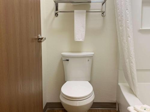 a bathroom with a white toilet and a bath tub at Quality Inn Albuquerque East I-40 Juan Tabo Exit in Albuquerque
