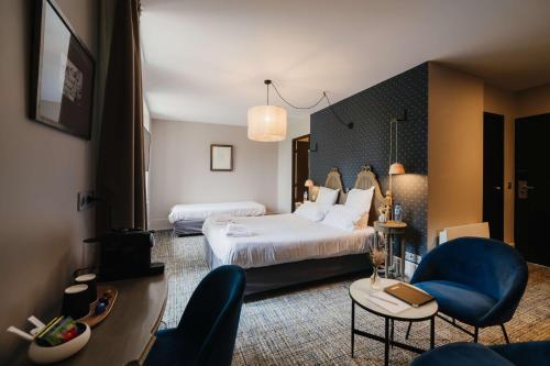 Ένα ή περισσότερα κρεβάτια σε δωμάτιο στο Hotel la Robeyere; BW Signature Collection