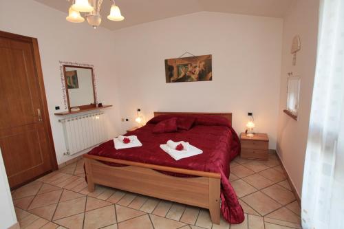Posteľ alebo postele v izbe v ubytovaní Appartamenti Il Borgo