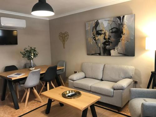 a living room with a couch and a table at Home SEA&DREAMS OldTown II in Calpe
