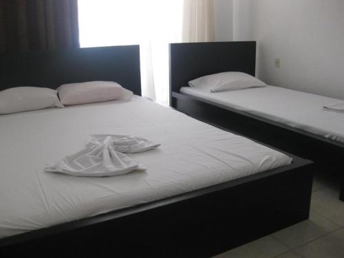 Ένα ή περισσότερα κρεβάτια σε δωμάτιο στο Philippos & Maria Apartments