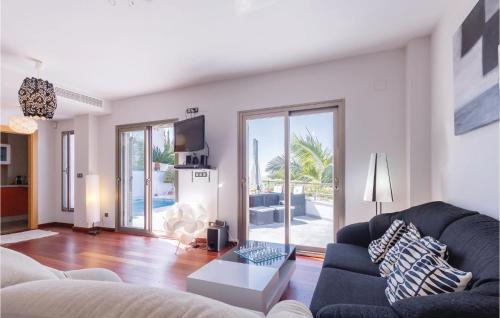 a living room with a couch and a table at Amazing Home In Almuñecar in Almuñécar