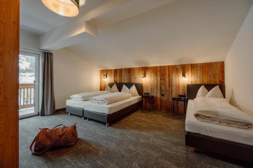 מיטה או מיטות בחדר ב-StadlHof