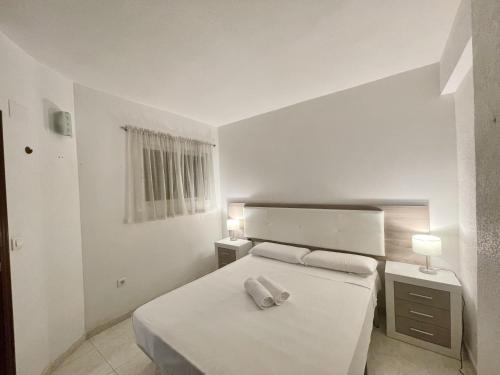 A bed or beds in a room at APARTMENT IN BENIDORM CITY CENTER