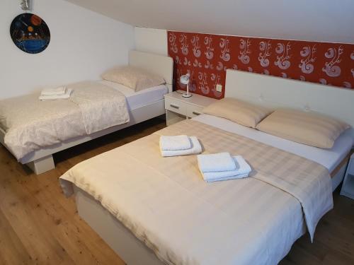 A bed or beds in a room at Apartma Louis