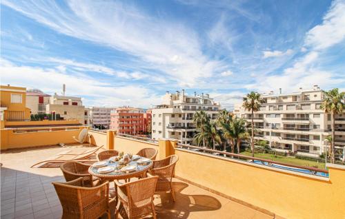 a patio with a table and chairs on a balcony at Cozy Apartment In Denia With Wifi in Denia