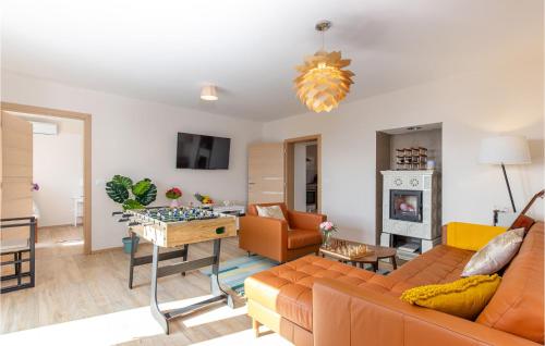 a living room with a couch and a table at Cozy Home In Lovran With Wifi in Lovran