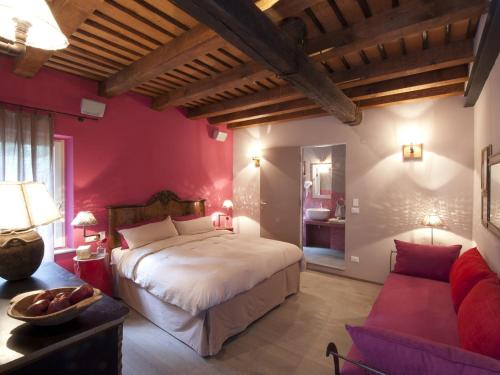 A bed or beds in a room at Casa Fluò Relais