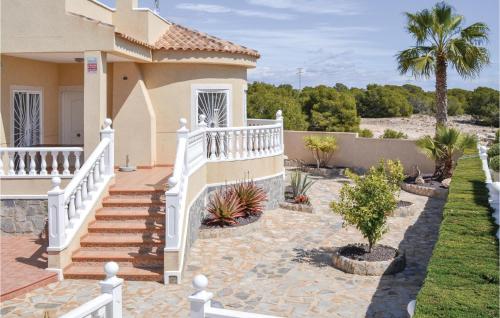 a house with a white staircase in a yard at Beautiful Home In Quesada-Rojales in Rojales
