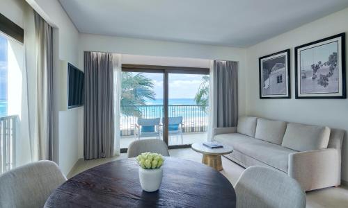 a living room with a couch and a table at Al Alamein Hotel in El Alamein