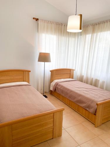 Villa SeaBerry tesisinde bir odada yatak veya yataklar
