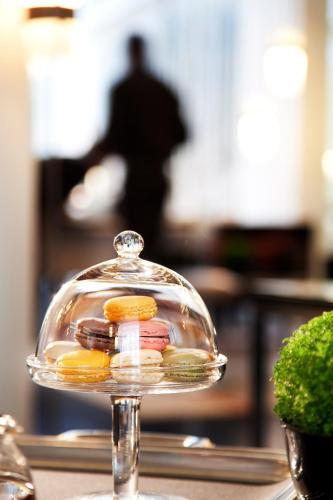 a glass dish filled with different types of food at Le A in Paris