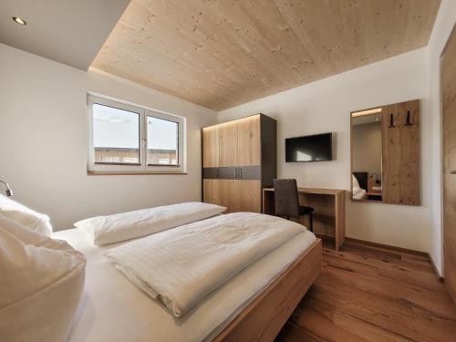 Postel nebo postele na pokoji v ubytování Gästehaus Sonne