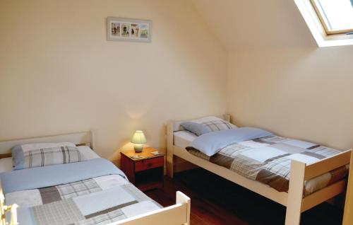 Łóżko lub łóżka w pokoju w obiekcie La Grande Chaise