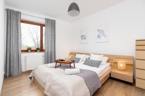 Posteľ alebo postele v izbe v ubytovaní Dzielnica XIII Podgórze Kraków by Noclegi Renters