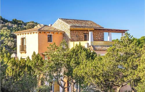 a house on top of a hill with trees at Bilo 4 in Porto Cervo